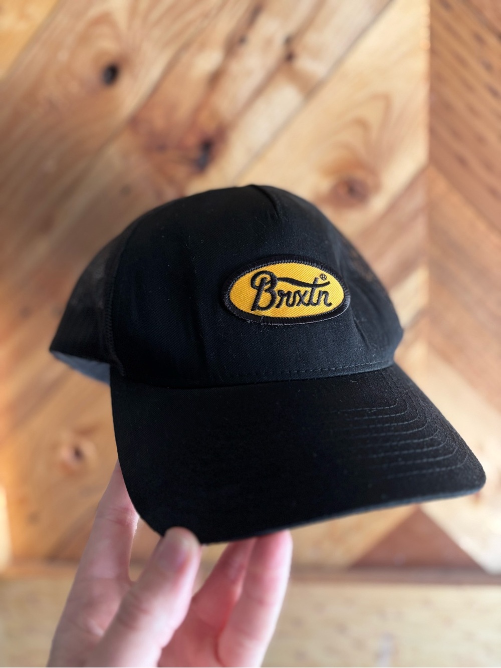 Brixton Black Cap with Yellow Oval Logo Patch